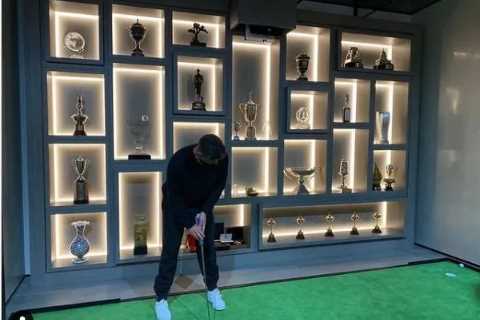 Inside Justin Rose’s amazing trophy room with backlit wall-to-wall cabinet to display career..