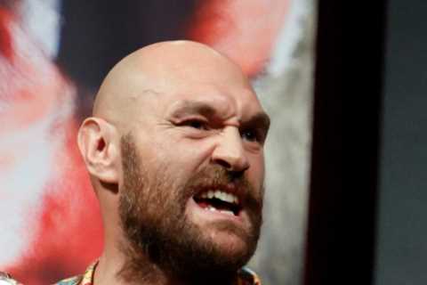 Tyson Fury wears incredible bespoke suit with WBC belts plastered over it to taunt rival Deontay..