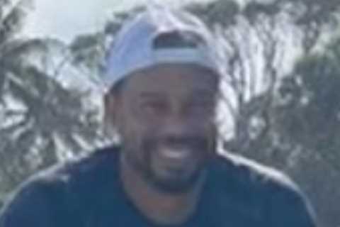 Tiger Woods back on golf course for first time since horror car crash with leg out of brace as he..