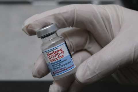 Moderna argues the F.D.A. should authorize a half-dose of its vaccine as a booster.