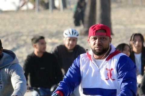 Floyd Mayweather spotted on bike ride along beach in LA as 44-year-old keeps fit after boxing return