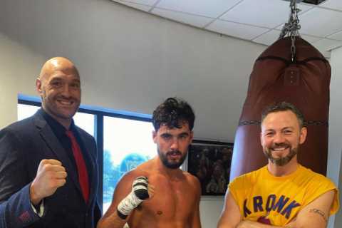 Tyson Fury looks dapper in £560 Versace shoes and suit jacket as he helps coach in local gym after..