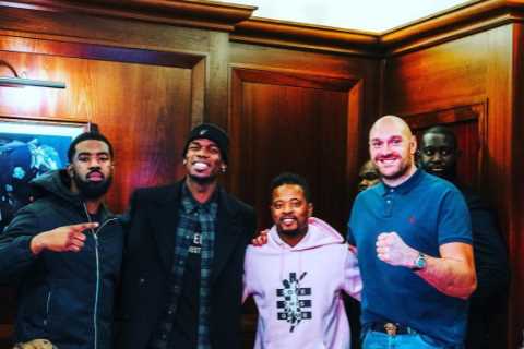 Man Utd fan Tyson Fury poses with Paul Pogba and Patrice Evra at Old Trafford in silver lining..