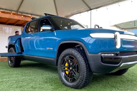Rivian prices its I.P.O., valuing the electric-vehicle maker at nearly $70 billion.