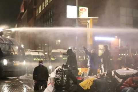 Dutch protesters blasted with water cannons by riot cops as lockdown returns amid Covid surge..