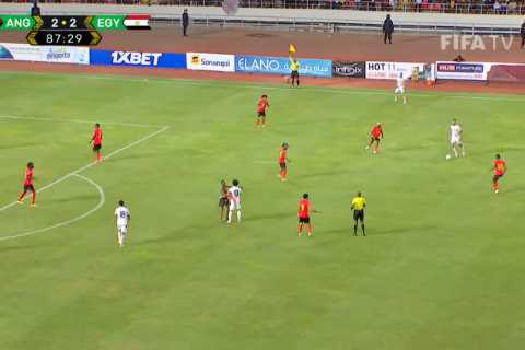 Mo Salah mobbed as Angola vs Egypt paused THREE TIMES after home fans invade pitch for selfies with ..