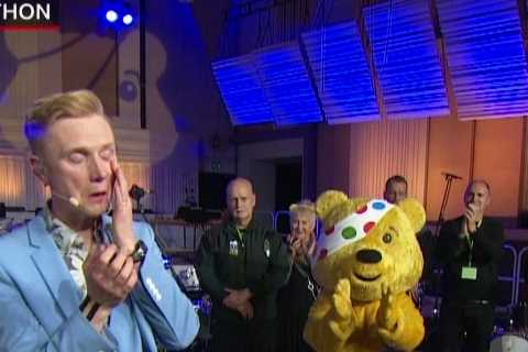 Owain Wyn Evans in tears as he completes Children In Need drumathon with Britney Spears tribute