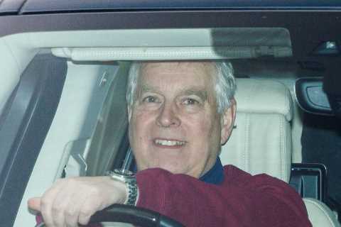 Prince Andrew smiles during drive around royal grounds at Windsor