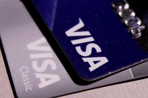 Amazon, railing against high fees, will stop accepting Visa credit cards issued in Britain.