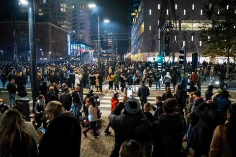 Dutch police fire warning shots as riots erupt in Rotterdam against Covid lockdown with protestors..
