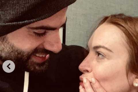 Lindsay Lohan announces she is engaged to Bader Shammas and shows off huge ring