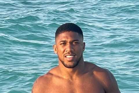 Anthony Joshua channels inner James Bond as he shows off bulging muscles in ocean after refusing to ..