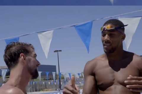 Watch Anthony Joshua race Olympic legend Michael Phelps as Adam Peaty jokes he needs to work on his ..