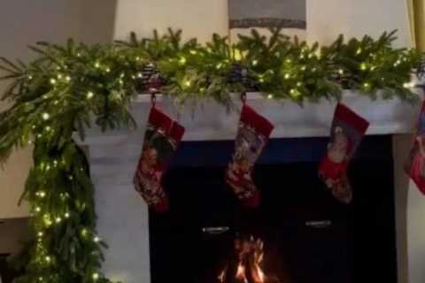 Kendall Jenner shows off festive Christmas decorations with lights, stockings and garland around..