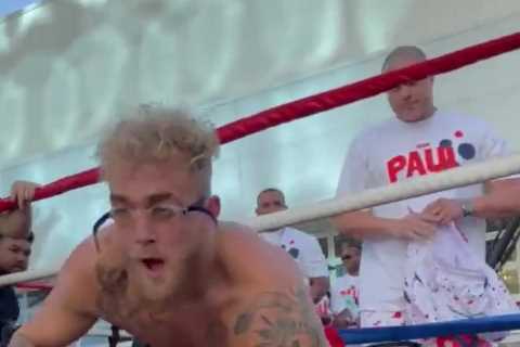 Jake Paul leaves boxing ring to go SWIMMING with shoes on in open workout and rules out ever..