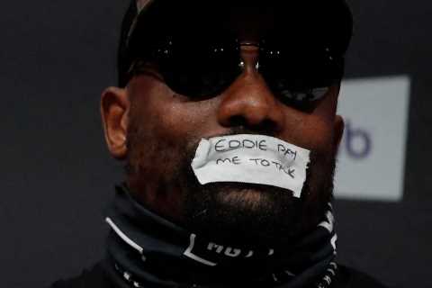 Derek Chisora tapes mouth shut with taunting message to Eddie Hearn in bizarre press conference for ..
