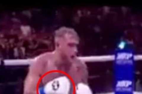 Jake Paul and Tyron Woodley accused of FIXING fight after ‘secret hand signal’ spotted moments..
