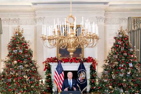 ‘We’re Still in It’: Biden Urges Calm as He Steps Up Omicron Fight