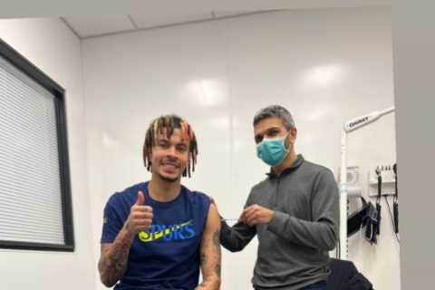 Tottenham star Dele Alli gives a thumbs-up as he gets his Covid booster jab
