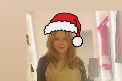 Carol Vorderman glitters in gold as she shows off clinging Christmas Day outfit