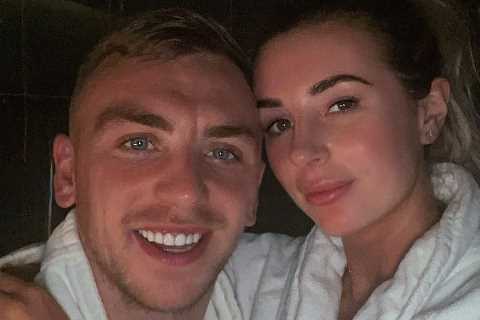 Dani Dyer cuddles up to West Ham boyfriend Jarrod Bowen as they cosy up in matching dressing gowns