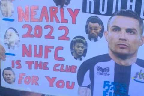 Newcastle fan holds up hilarious sign urging Cristiano Ronaldo to join club from Man Utd in the..