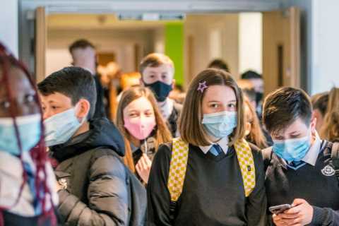 Teachers told to combine classes to deal with Covid staff shortages as ministers mull over return..
