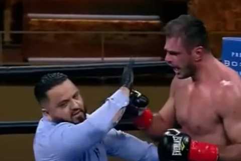 Watch heavyweight boxer PUNCH referee after being handed controversial loss which saw crowd angry..