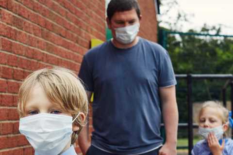 If a parent tests positive for Covid can the child go to school?