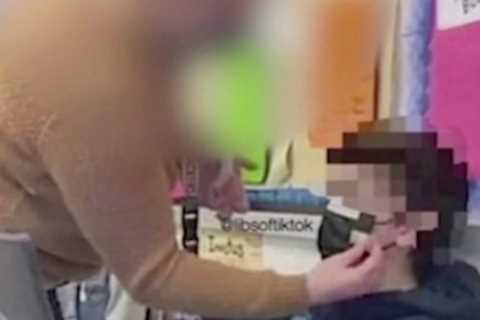 Fury as shock photo shows teacher taping mask to young student’s face