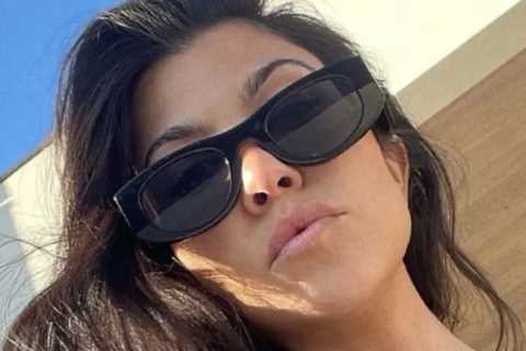 Kourtney Kardashian shows off her curves in a tiny swimsuit as fans speculate she’s pregnant with..