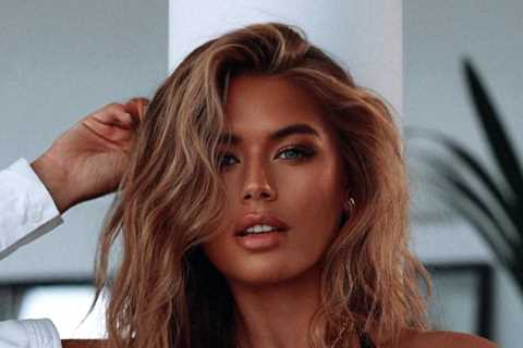 Stunning Arabella Chi turns up the heat in black lingerie and suspenders after being accused of..