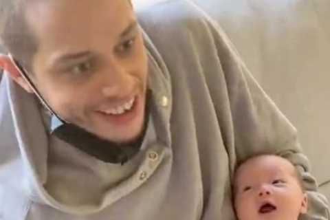 Pete Davidson holds John Mulaney &amp; Olivia Munn’s newborn son as romance with Kim Kardashian..
