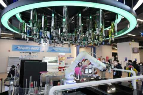 Winter Olympics village has pink robots serving food and stars can book Covid-friendly naps with..