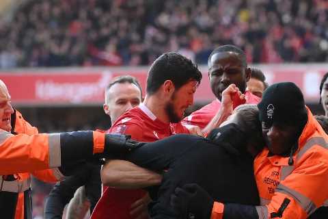 Football chiefs set for crisis talks with police over fan violence after players attacked on pitch..
