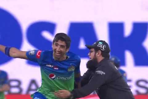 Watch cricket umpire Aleem Dar bizarrely try to tackle bowler as he celebrates taking wicket in..