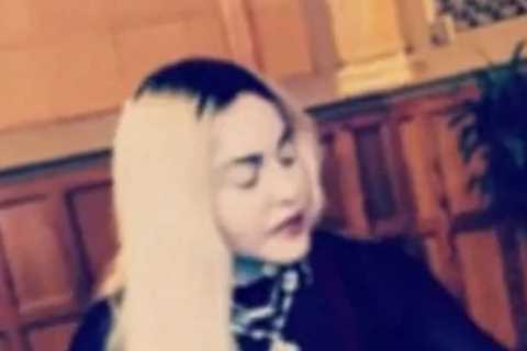 Madonna, 63, looks younger than ever as she plays guitar and rides a stairlift in bizarre video
