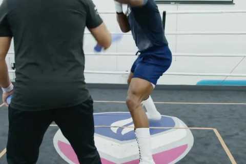 Fans notice Anthony Joshua studying Tyson Fury in background while showing off explosive power in..