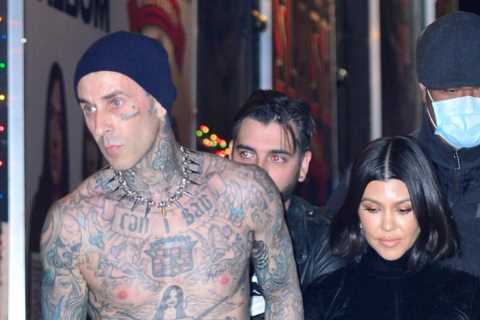 Kourtney Kardashian stuns in black dress &amp; holds shirtless Travis Barker’s hand as they’re..