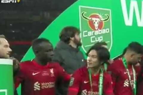 Watch Sadio Mane ask Takumi Minamino to put champagne down as Liverpool celebrate epic Carabao Cup..