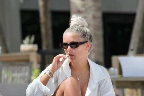 Molly Mae Hague looks incredible as she eats salad by the pool with £2,500 designer beach bag in..