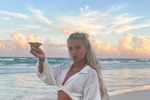 Tommy Fury brands Molly-Mae Hague a ‘role model’ as she eats pizza on the beach to mark..