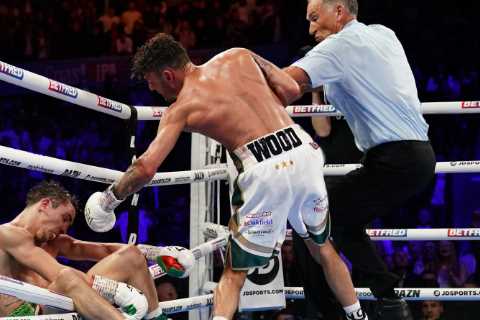 Michael Conlan shows off nasty facial injuries from hospital bed after falling through ropes in..