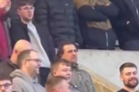 Watch as fans bizarrely exchange numbers DURING Millwall clash against Middlesbrough and call each..