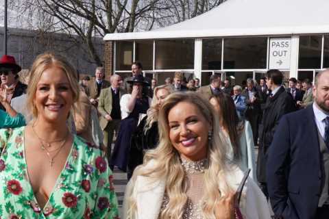 Cheltenham racegoers all smiles as they glam up in bright colours, bodycon dresses and towering..