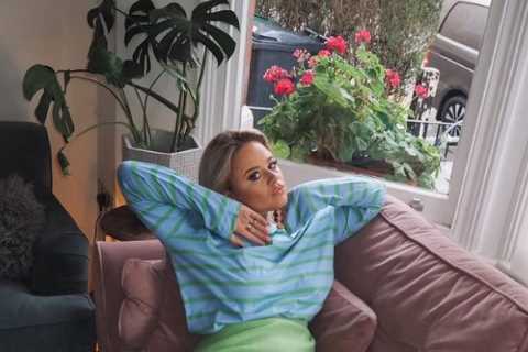 Emily Atack admits getting a ‘b******ing’ for late night partying as she relaxes on the sofa..