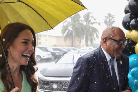 Kate Middleton is all smiles as rain lashes down during school visit with Prince William in Bahamas