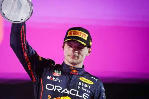 Watch F1 champ Max Verstappen race ONE-HANDED at 200MPH as he tries to remove piece of plastic..
