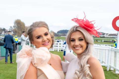 Revellers enjoy pints in the sun &amp; snap selfies as they spend a day at the races during the..