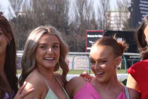 Glam crowds pose for pics as they enjoy a day at the races during the Scottish Grand National